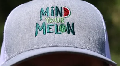 Baseball hat with "Mind Your Melon" stitched on front